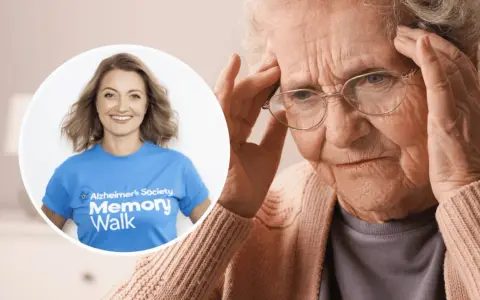 Kobieta z bólem głowy, być może objawy alzheimera. Obok uśmiechnięta wolontariuszka Alzheimer's Society Memory Walk.